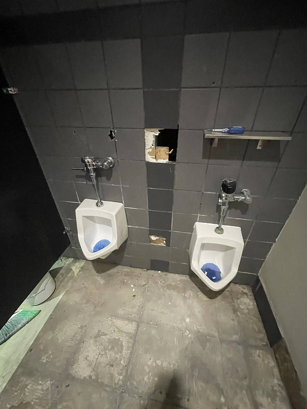 Commercial restroom during tile installation