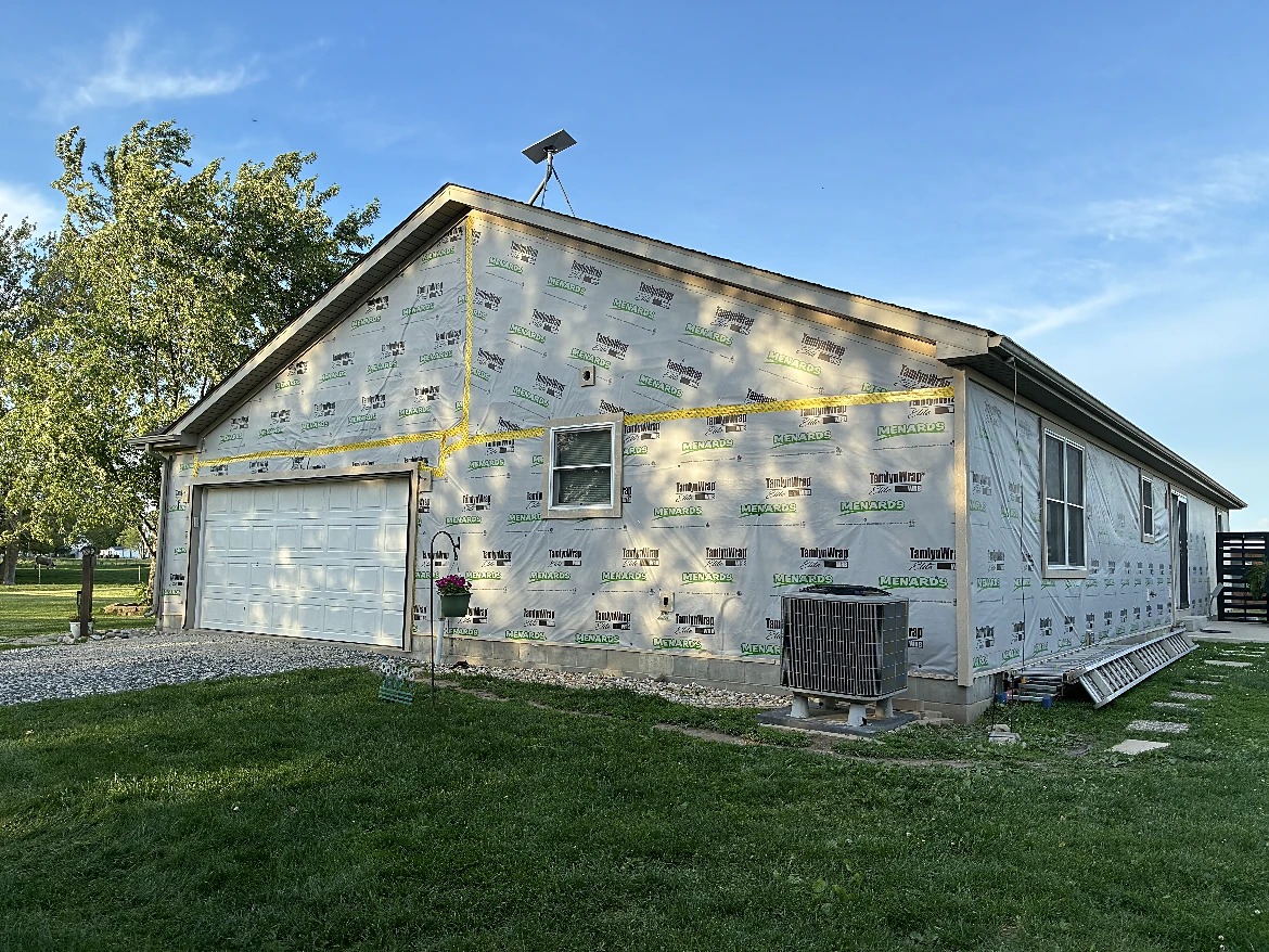 Home exterior with weathered siding before refresh